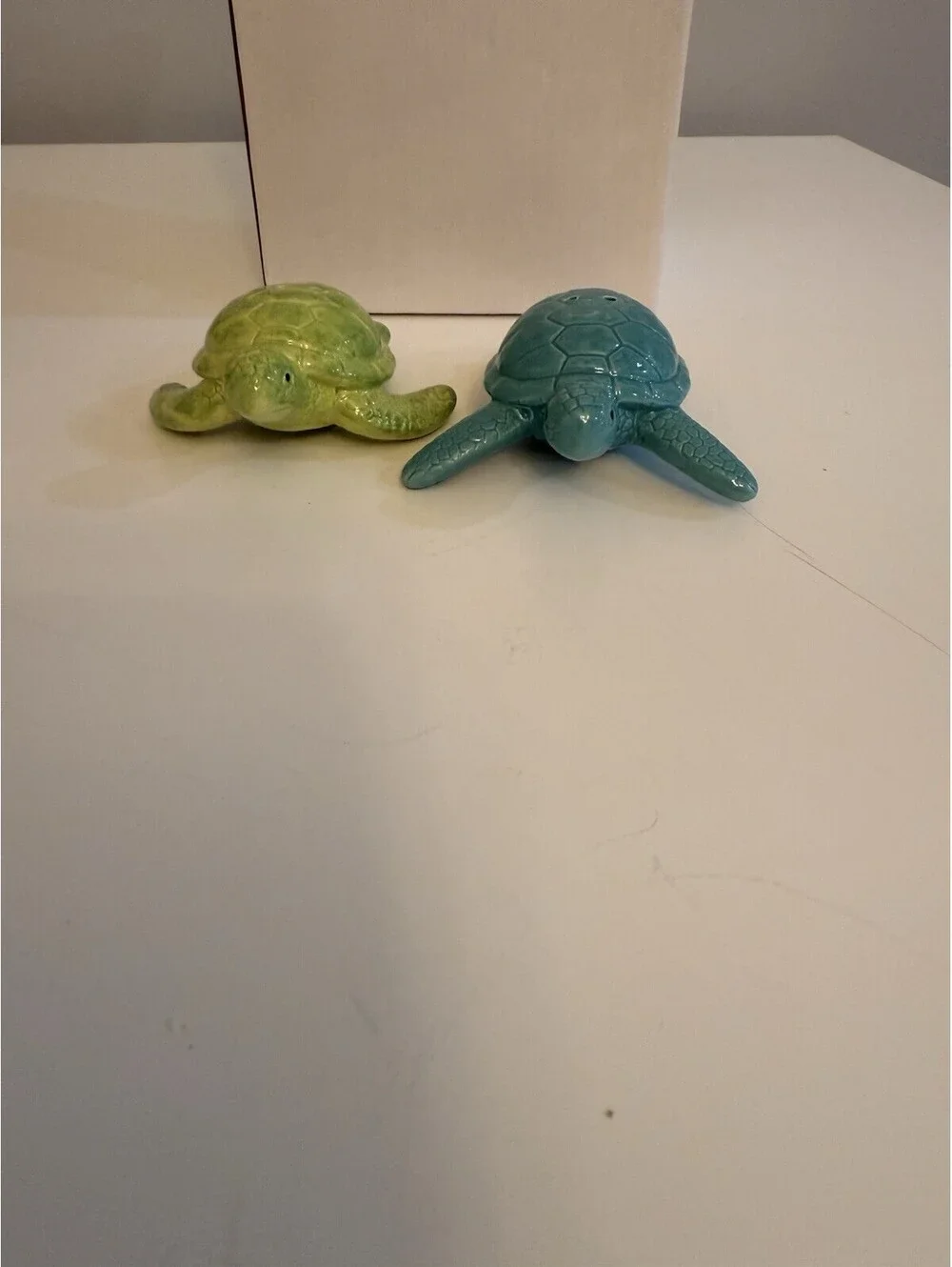 Cape Shore add a touch of ocean charm to your dining experience with the cape shore ceramic turtles salt & pepper set  colored in serene blue and green